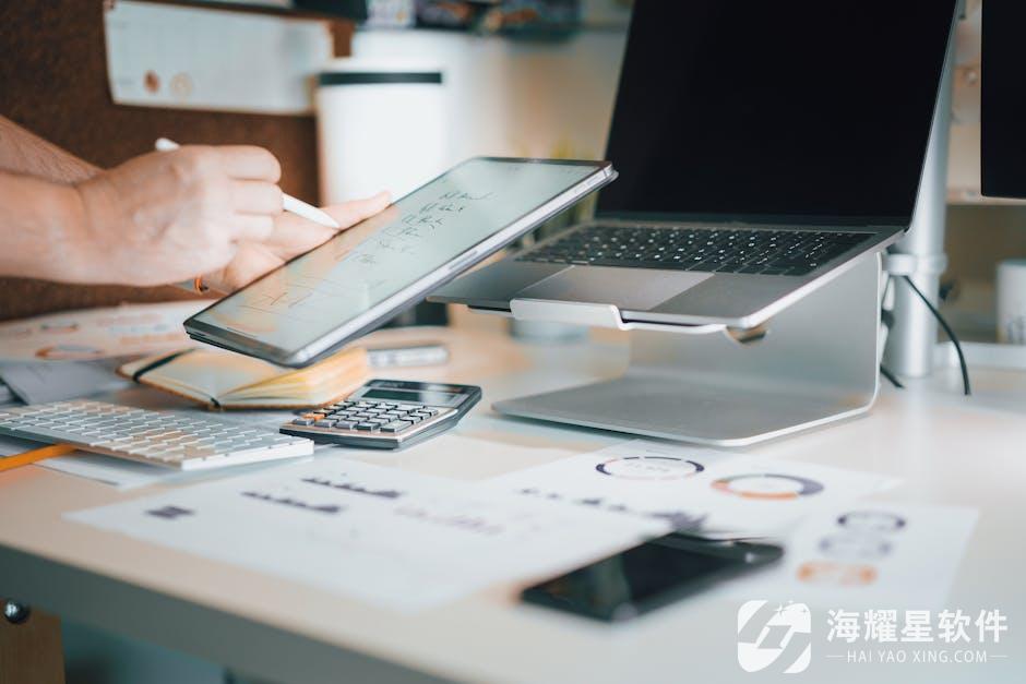 A stylish office desk setup featuring laptops, tablets, and other technological devices for productivity.