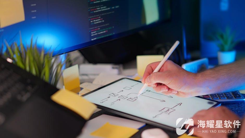 A vibrant workspace featuring digital sketching on a tablet and code on a monitor, showcasing a tech-savvy environment.