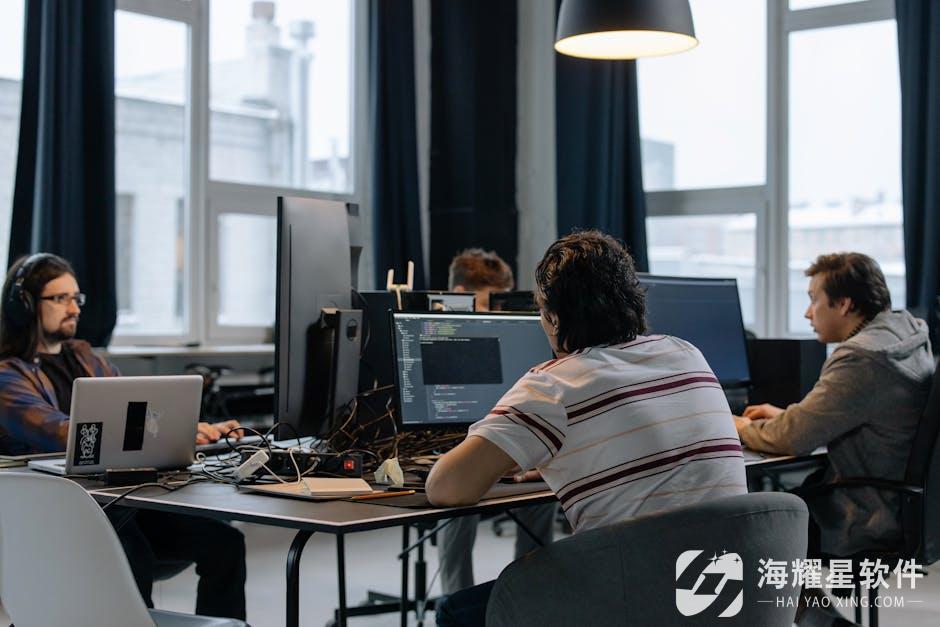 Team of developers working together on computers in a modern tech office.