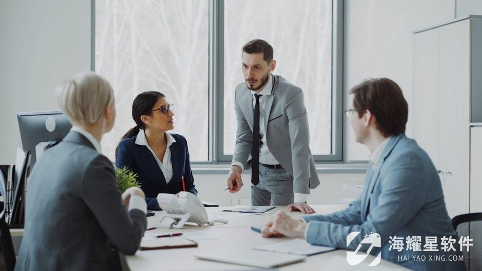 Professionals engaged in a serious business discussion in a bright office environment.