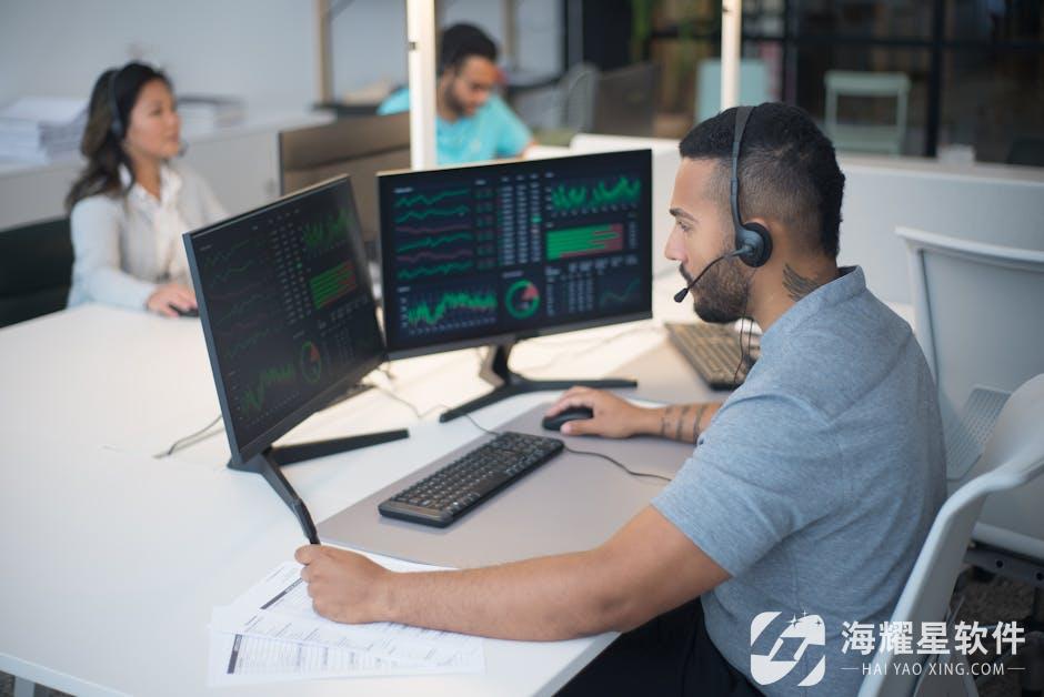 Team of customer service professionals working with headsets and computers in a modern office.