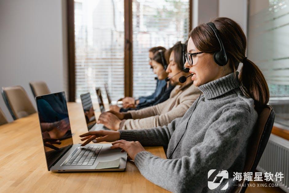 Professional customer service team working in a modern office setting with headsets and laptops.