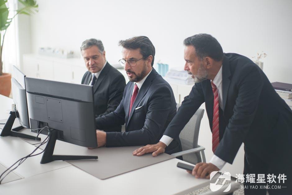 Professionals collaborating on a project in a modern office setting.