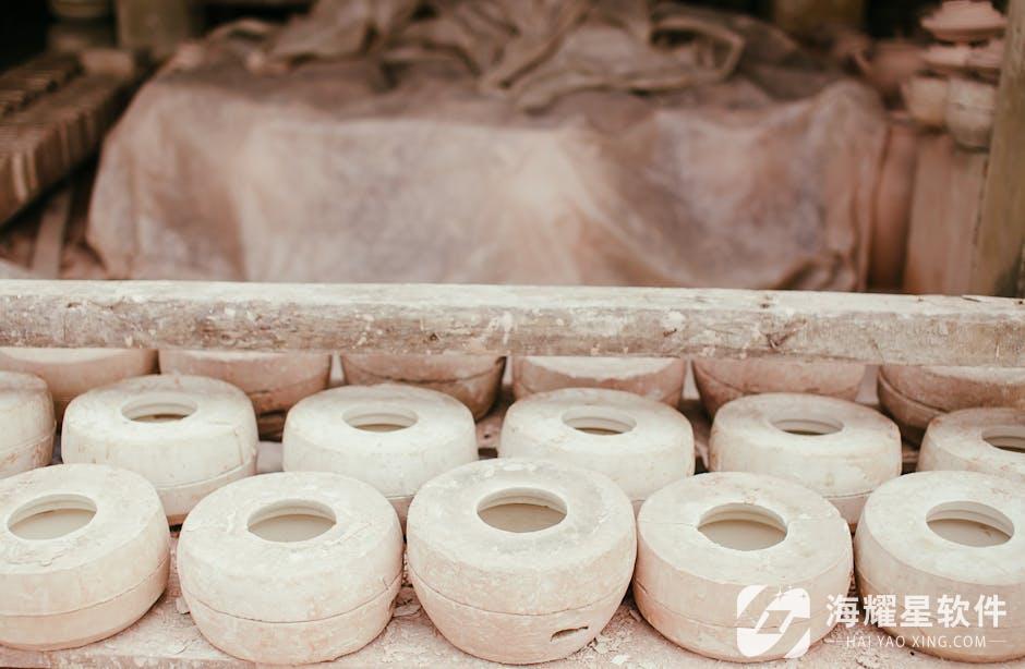 Handmade pottery clay molds arranged in a rustic artisan workshop setting.