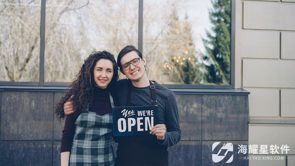 Happy small business owners embracing and displaying an open sign outdoors.